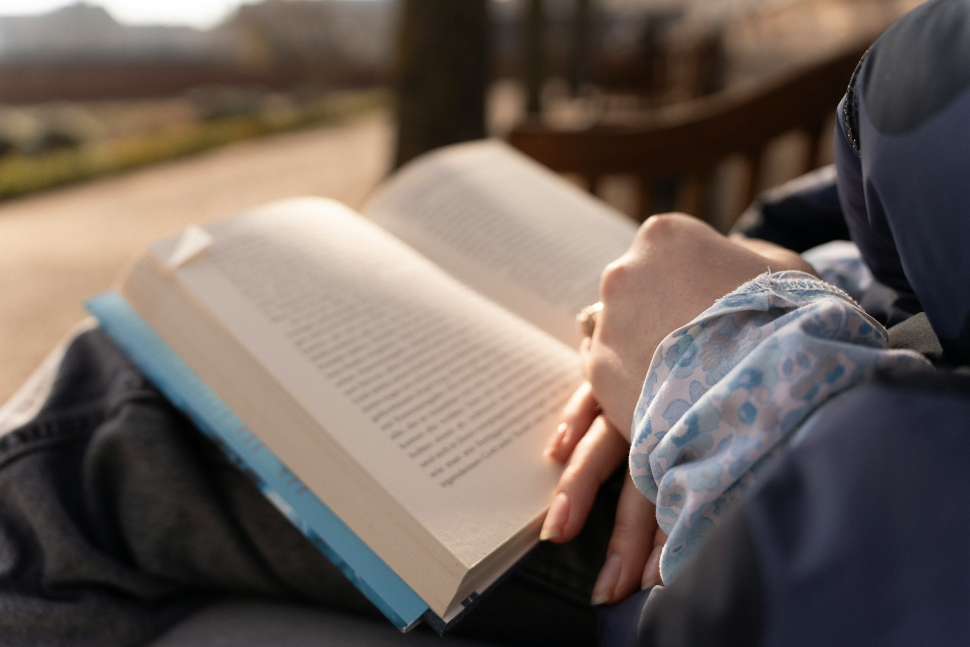 reading on park bench